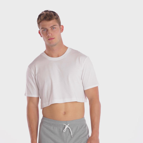 A WHITE WALL VIDEO OF A MALE MODEL WEARING THE SAMMY SHOP UNISEX WHITE MINI CROP T-SHIRT