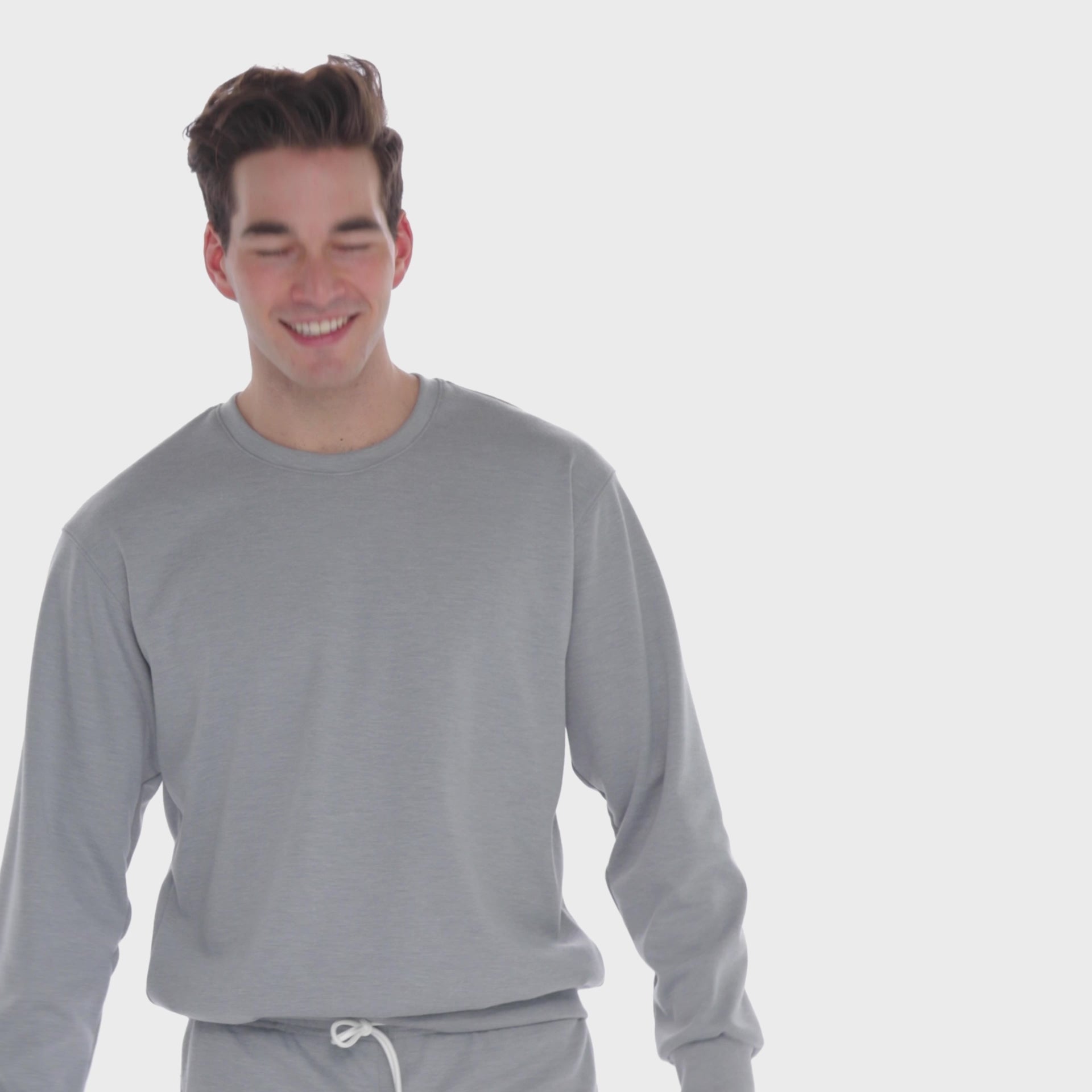 A WHITE WALL VIDEO OF A MALE MODEL WEARING THE SAMMY SHOP UNISEX GRAY EVERYDAY CREW SWEATSHIRT