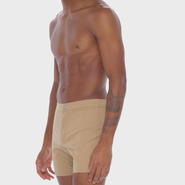 A WHITE WALL VIDEO OF A MALE MODEL WEARING A SAMMY SHOP UNISEX SAND VERSATILE SHORT
